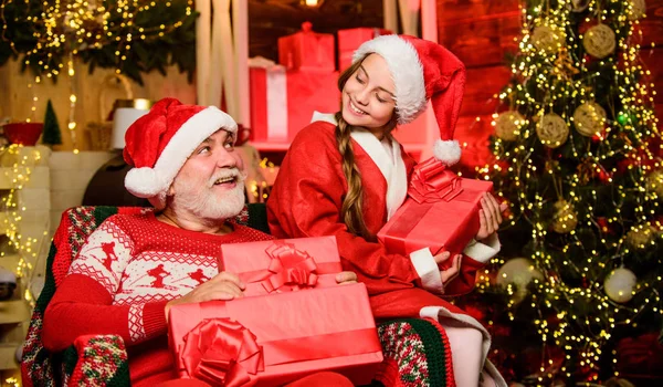 Granddaughter spend time with grandpa. Christmas eve. Family home. Family relationships. Visiting grandparents. Happy childhood. Family tradition concept. Boxing day. Child christmas with Santa claus — Stock Photo, Image