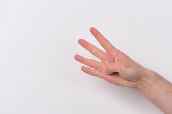 Count down and numbers concept. Male hand shows four fingers — Stock Photo, Image