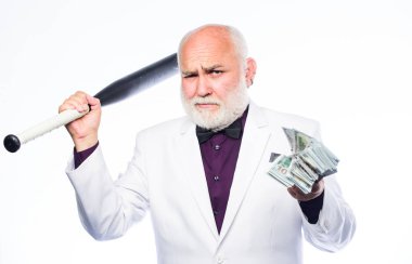 Başarılı bir iş adamı. Acımasız iş hayatı. Raket ve baskın. Kingpin konsepti. Kara nakit para. Kıdemli adam nakit para ve beyzbol sopası tutuyor. Zenginlik refahı. Para karı. Kişisel güvenlik