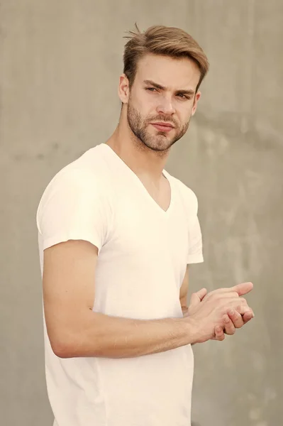 Handsome man stylish hairstyle. Handsome caucasian man gray background. Pensive mood. Ideal traits that make man physically attractive. Bearded guy casual style close up. Male beauty standards