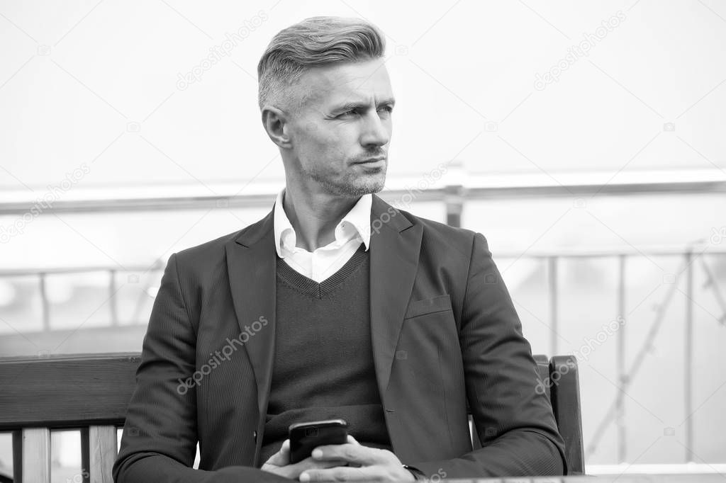 Waiting for message. Modern life demands modern gadgets. Man with smartphone. Mobile phone always with me. Hipster well groomed man use smartphone. Internet surfing social networks with smartphone