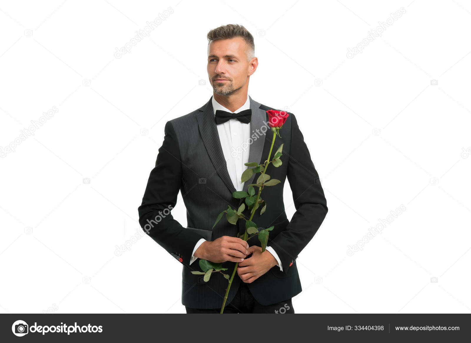 Black tie dress code for evening tuxedo man with rose