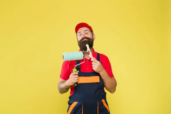 Build and construction. professional repairer. serious builder man. bearded worker. Hard worker with painting brush and roller. Construction worker ready to work. brutal hipster try to be craftsman — 스톡 사진