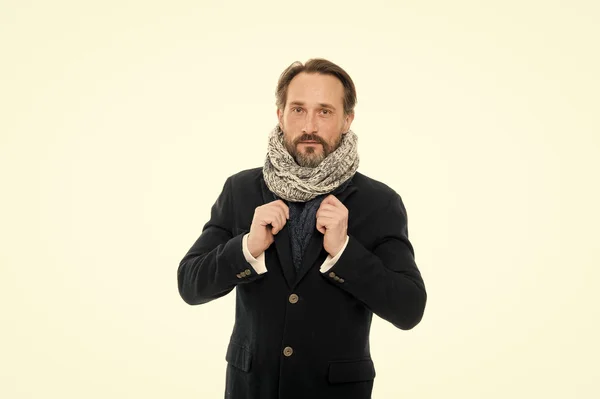 Winter is coming. Get ready for frosty days. Mature fashion model enjoy cold weather. Bearded man accessorizing outfit with scarf. Winter wardrobe for fashionable man. Winter outfit. Feeling cozy