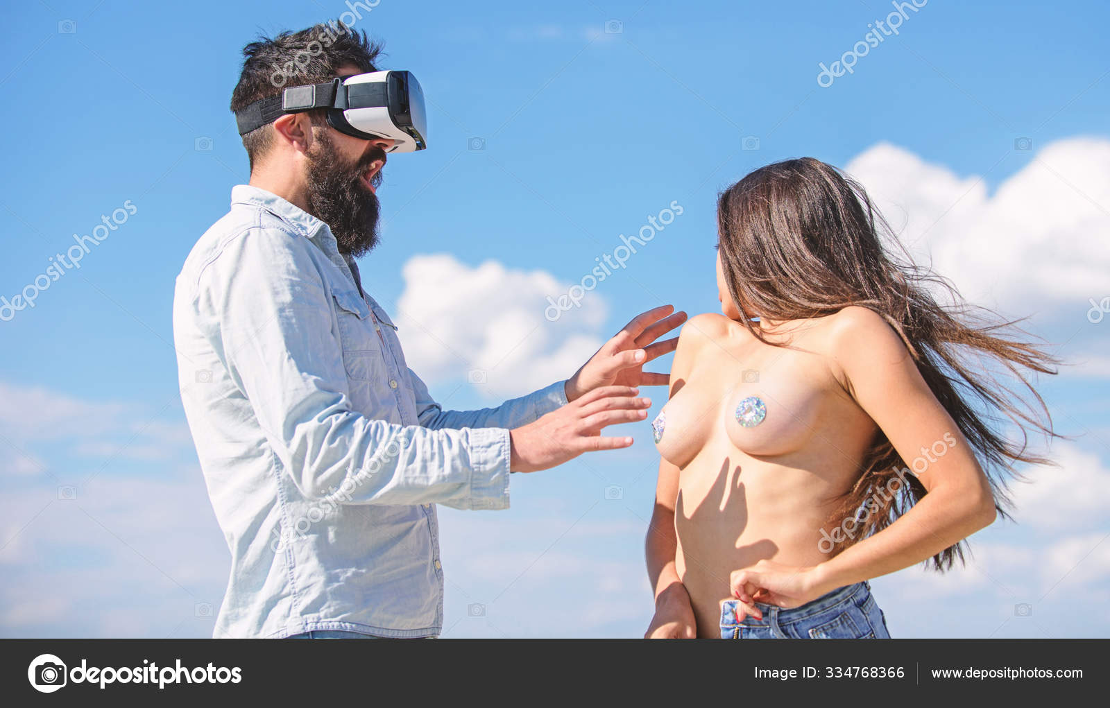 Play virtual sex game. Intimate sensation concept. Hipster man play virtual sex game hmd or vr glasses. Man touch sexy naked erotic breasts virtual girl