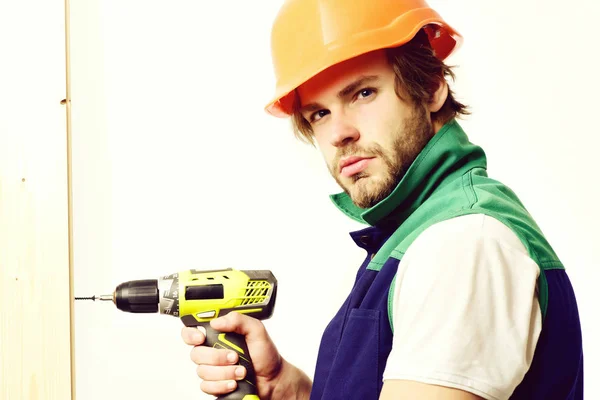 Work in progress and repairing concept. Construction worker holds drill — Stock Photo, Image