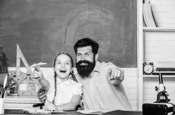 We are the team. daughter study with father. Teachers day. knowledge day. Home schooling. private lesson. small girl child with bearded teacher man in classroom. back to school. Private teaching — Stock Photo, Image