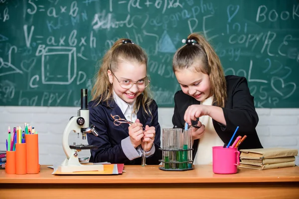 Science experiments in chemistry laboratory. Little scientist work with microscope. Biology lesson. Chemistry research. Little girls in school lab. Medicines you can trust. Chemistry education — Stock Photo, Image