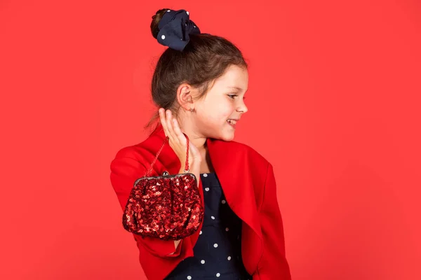 Vintage trend. Elegant retro kid. Small girl vintage fashion outfit. Glamorous accessory. Handbag purse and pouch accessory. Vintage fashion model. Charming little lady. Exquisite manners concept
