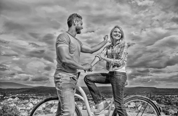 How to meet girls while riding bike. Man with beard and shy blonde lady on first date. Couple just meet to become acquainted. Woman feels shy in company with attractive macho. Picking up girl