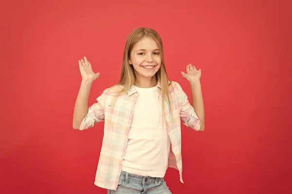 Best day ever. stylish beauty. small girl red background. happy childhood. smiling blonde kid. child girl with long blonde hair. casual style. childrens day. fashionable little girl. kid fashion — Stock Photo, Image
