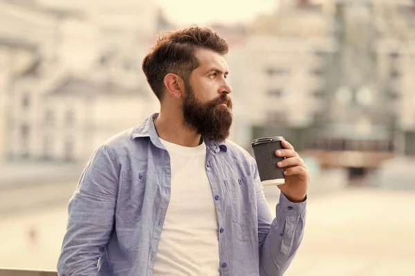 Great ideas come from great coffee. Man drink take away coffee. Morning coffee. Mature hipster enjoy hot beverage. Bearded man relax outdoors. Coffee break concept. Caffeine addicted