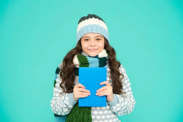 education. Girl reading book. kid enjoying her book. winter story reading. christmas eve. little book lover. my favorite story. leisure in winter time. childhood development. child use notebook