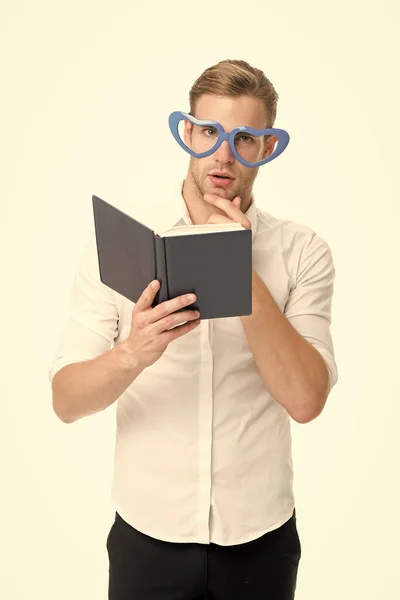 Self improvement literature. University student with lecture notes. Teacher funny guy. Male student reading. Student handsome diligent man. Book nerd wearing cute glasses. Man with book. Study hard