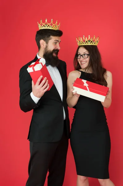 Wow. Surprised king and queen. Business couple got surprise reward. Bearded man and sexy woman hold surprise boxes. Surprise and recognise. Present and souvenir. Gift shop. Gifting surprise