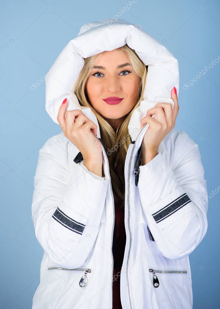 Fancy winter clothes. Not every jacket is ideal for every climate. Girl wear white jacket. Jacket has extra insulation and slightly longer fit in order to protect your body from sharp winter weather