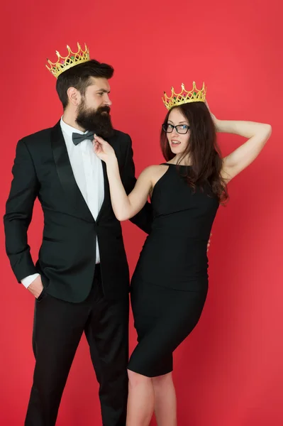 Success is our goal. Happy lovers celebrate success. Couple in love wear crowns red background. Enjoying success. Pride and pleasure. Successful and proud. Victory and triumph. Total success