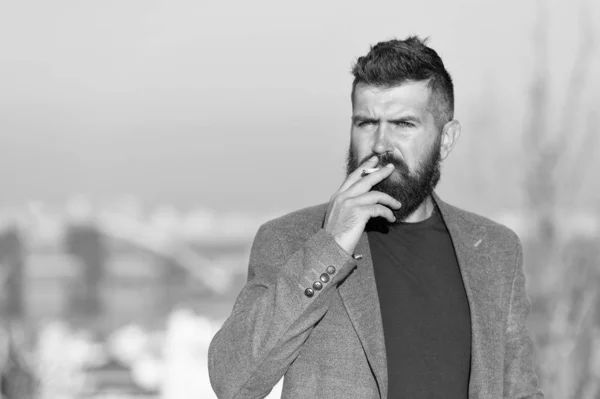 Nicotine abuse. Cigarette smoker. Bearded man smoke nicotine cigarette outdoor. Addiction to nicotine. Smoking habit comes from nicotine dependence Bad habit — Stock Photo, Image