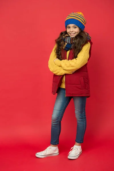 Hipster fashion trend. Happy winter holidays activity. Feeling warm and happy. Comfy style. Cheerful smiling child long hair in stylish outfit. Winter wardrobe. Fashion shop. Winter fashion