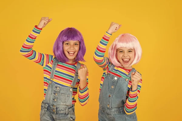 Anime convention. Anime cosplay party concept. Animation style characterized colorful graphics vibrant characters fantastical themes. Happy little girls. Anime fan. Cheerful friends in colorful wigs