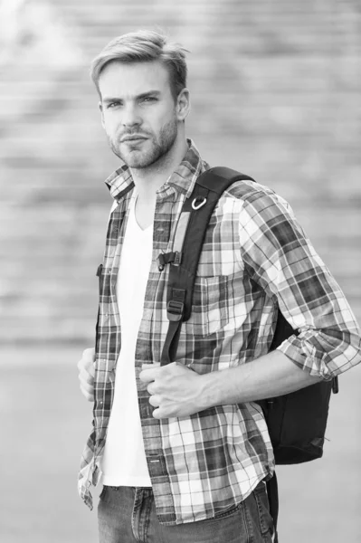 College education. College life. Modern student. College student with backpack urban background. Handsome guy study in university. Education boost successful future. Man regular student appearance