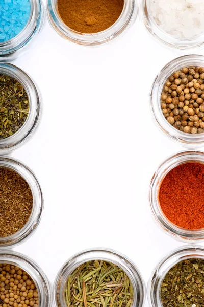 Different spices in bowls on table Set of seasoning making frame. — Stock Photo, Image
