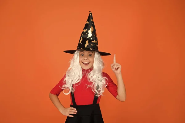 Ghosts have real spirit. Little child witch costume. Halloween party. Small girl in black witch hat. Autumn holiday. Join celebration. Magical spell. Small witch with white hair. Wizard or magician — Stock Photo, Image