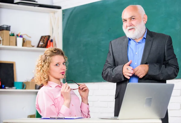 Work in education. Man mature school teacher and girl student with laptop. High school college university. Modern school. Communicate clearly and effectively. Lecturer educator sharing his knowledge — Stock Photo, Image