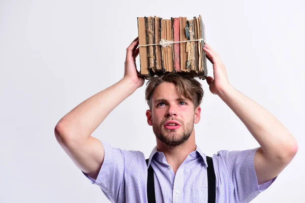 Man with pile of books on head on white background — 스톡 사진