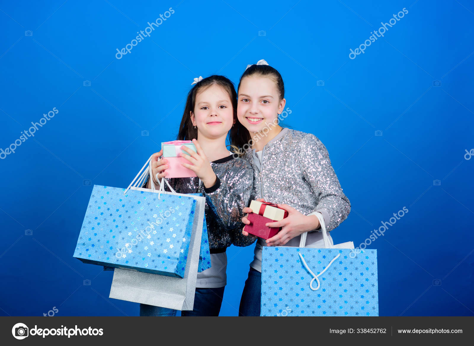 Girls Sisters Friends With Shopping Bags Blue Background Shopping And Purchase Black Friday Sale And Discount Children Bunch Packages Shopping Day Kids Fashion Every Product Delivered To You Stock Photo Image