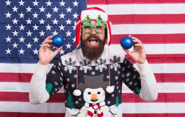 Smiling guy. Happy holidays. Merry Christmas. Holiday season in USA. Positivity concept. Happy new year. Happy santa celebrate xmas and new year. Bearded man happy smiling american flag background