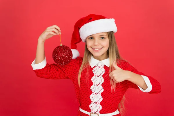 Big sale here. Child decorating christmas tree balls. santa kid decorative tree ball. feeling happy about xmas holiday. christmas shopping time. ready to celebrate new year. Pick decorations home. — Stock Photo, Image
