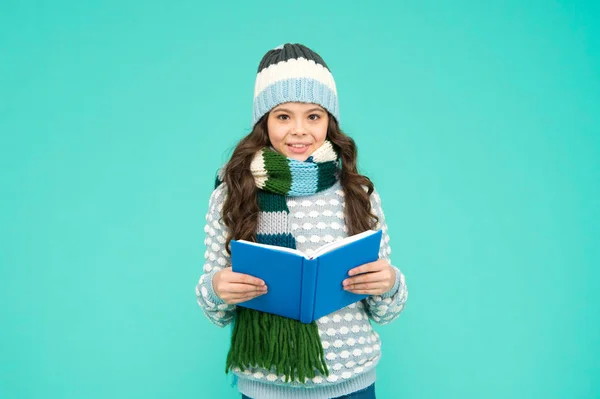 Winter story. Girl reading book. Kid enjoying book. Little book lover. My favorite story. Leisure in winter time. Childhood development. Interesting information. Library concept. Reading skills