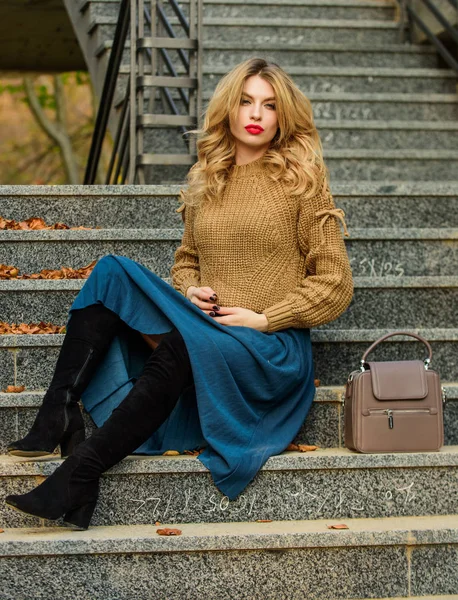 Totally relaxed. female beauty. Fashion model. girl in corrugated skirt and sweater. Pleated trend. girl long blond hair stairs. autumn woman curly hair outdoor. casual style student. fall season — Stockfoto