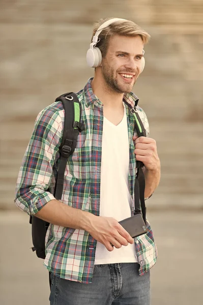 College education concept. College life. College student headphones smartphone. Online course. Audio book concept. Educational technology use physical hardware software and educational theoretic