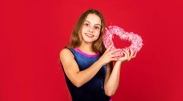 Heart shaped decor valentines day. Holiday of love and care. Little girl with pink heart. Feeling loved. Lovely baby. Adorable girl having fun. Romantic mood. Happy child hold heart red background — Stock Photo, Image