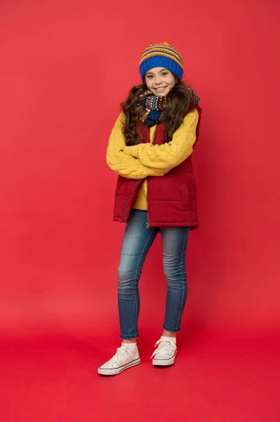 Style your look with casual outfit. Small child wear casual style. Little girl in casual clothing red background. Casual wardrobe for fall or winter. Add bold note to everyday look