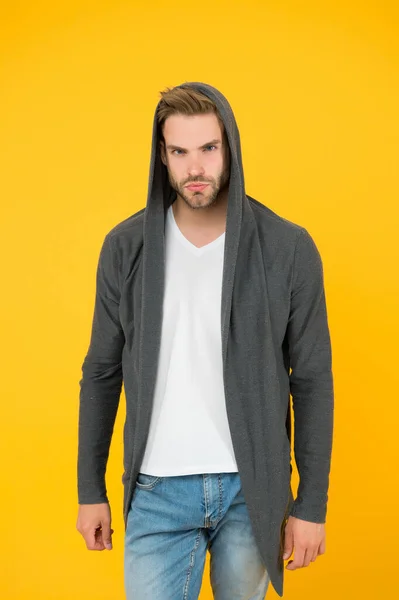Handsome and casual. Handsome man yellow background. Young guy wear hooded sweatshirt. Handsome model with fashion look. Fashion and style. Handsome and confident — Stock Photo, Image