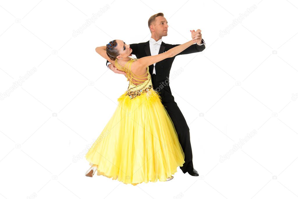 ballrom dance couple in a dance pose isolated on black background