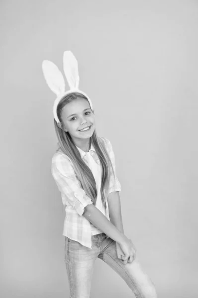 Cute bunny. Holiday bunny girl posing with cute long ears. Child smiling play bunny role. Happy childhood. Traditions for kids to help get in easter spirit. Bunny ears accessory. Easter activities — Stock Photo, Image