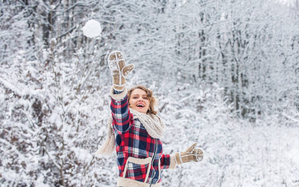 Real feelings. winter and people concept. having snowball fight. happy woman play snowball outdoor. girl in trendy winter jacket. girl wear mittens keep hands warm. good mood any weather