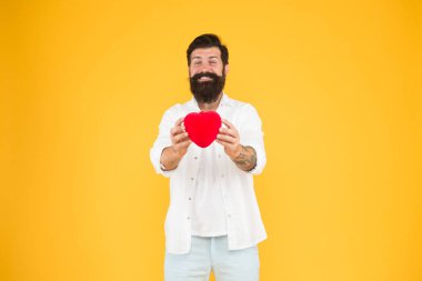 Celebrate valentines day. Romantic hipster sharing love. Spread love around. Generous lover. Love symbol. From sincere heart. Love you. Being honest. Romantic guy with red heart toy. Romance concept