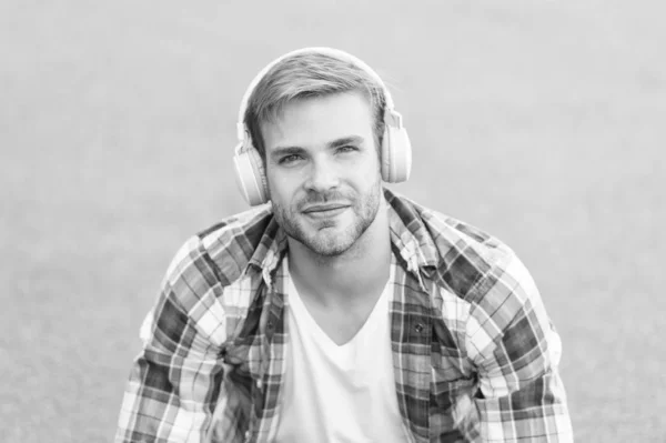Another way of learning. Man handsome college student headphones. Online learning. Audio book concept. Educational technology. E learning. Study anywhere. Worldwide knowledge access. Audio library