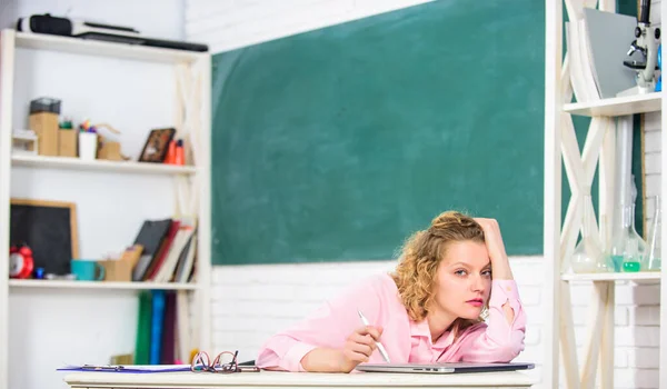 Tired tutor fall asleep at workplace. Tired student lean on desk. Woman tired in school classroom. School pedagogue stressful occupation. Exhausting lesson. Teacher exhausted after hard working day — Stock Photo, Image