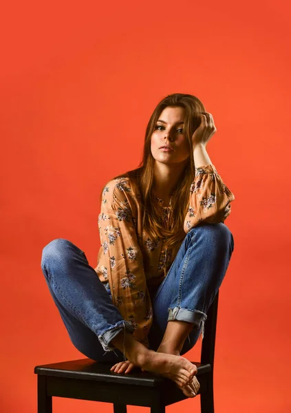 Feeling upset alone. feeling loneliness. lonely woman sit on chair. phycology. portrait of woman with beauty face. female fashion style. girl has long hair. thinking concept. lost in her thought — Stock Photo, Image