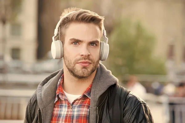 While walk. Online education courses. Listen music. Ebook audio concept. Student study use headphones. Handsome man urban background defocused. Distance education. Remote studying. Modern education — Stock Photo, Image