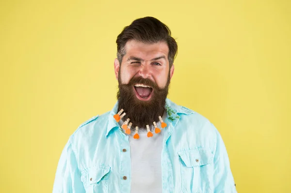 Brutal man. valentines day. love care my beard hair. laundry. hair drying. barbershop. man clothespin on beard. brutal male put clothespin with hearts on beard. bearded man hipster casual style — Stock Photo, Image