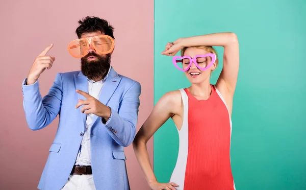 Just for fun. friendship. lets celebrate together. Office party. Best friends relations. bearded man with pretty woman. party fun. couple in love. hipster guy and girl party glasses