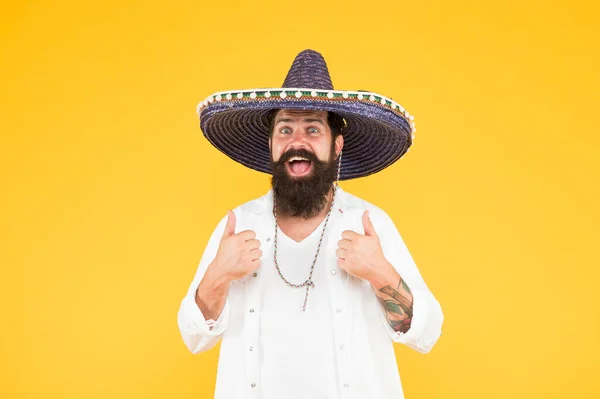 Plan summer vacation. Tourism concept. Hipster having fun. Cheerful mood. Mexican traditions. Explore mexican culture. Celebrate traditional mexican holiday. Happy man in sombrero souvenir straw hat — Stock Photo, Image
