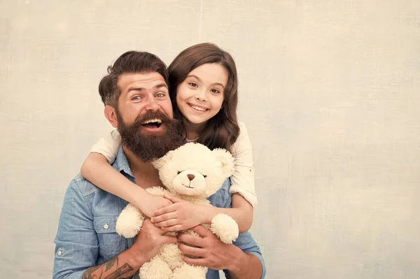 Teddy bear family member. Family relations. Fathers day concept. Lovely father and kid. Father and daughter light background. Strengthening father daughter relationships. Child and dad best friends